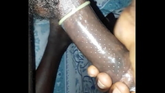 Kenyan boy dick in a condom feeling very horny at home Thumb